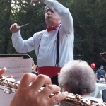 Conductor Eric Benjamin directing