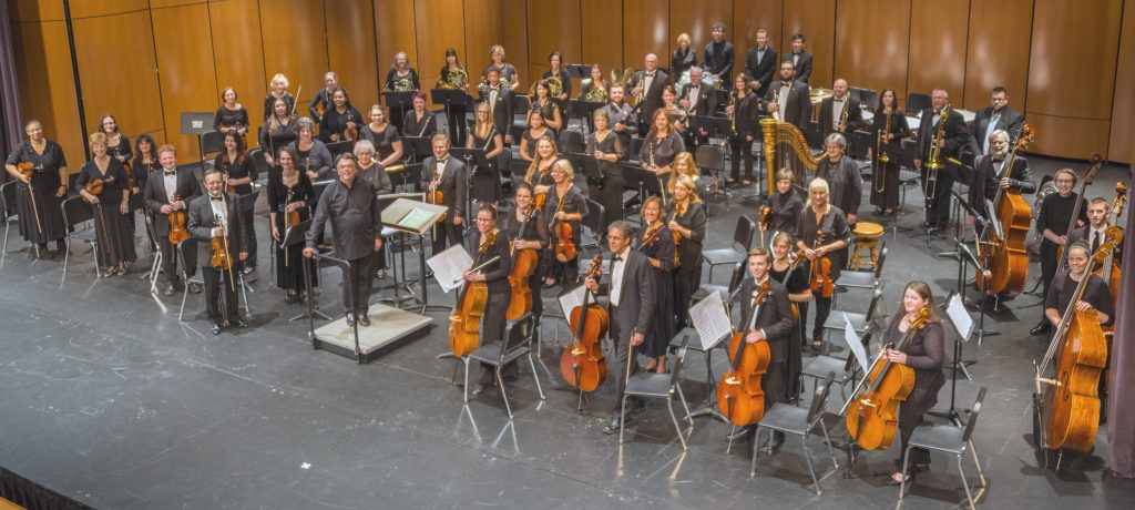 Alliance Symphony Orchestra standing on stage