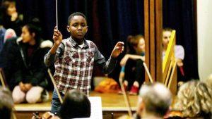 11-year old Matthew Smith conducts orchestra